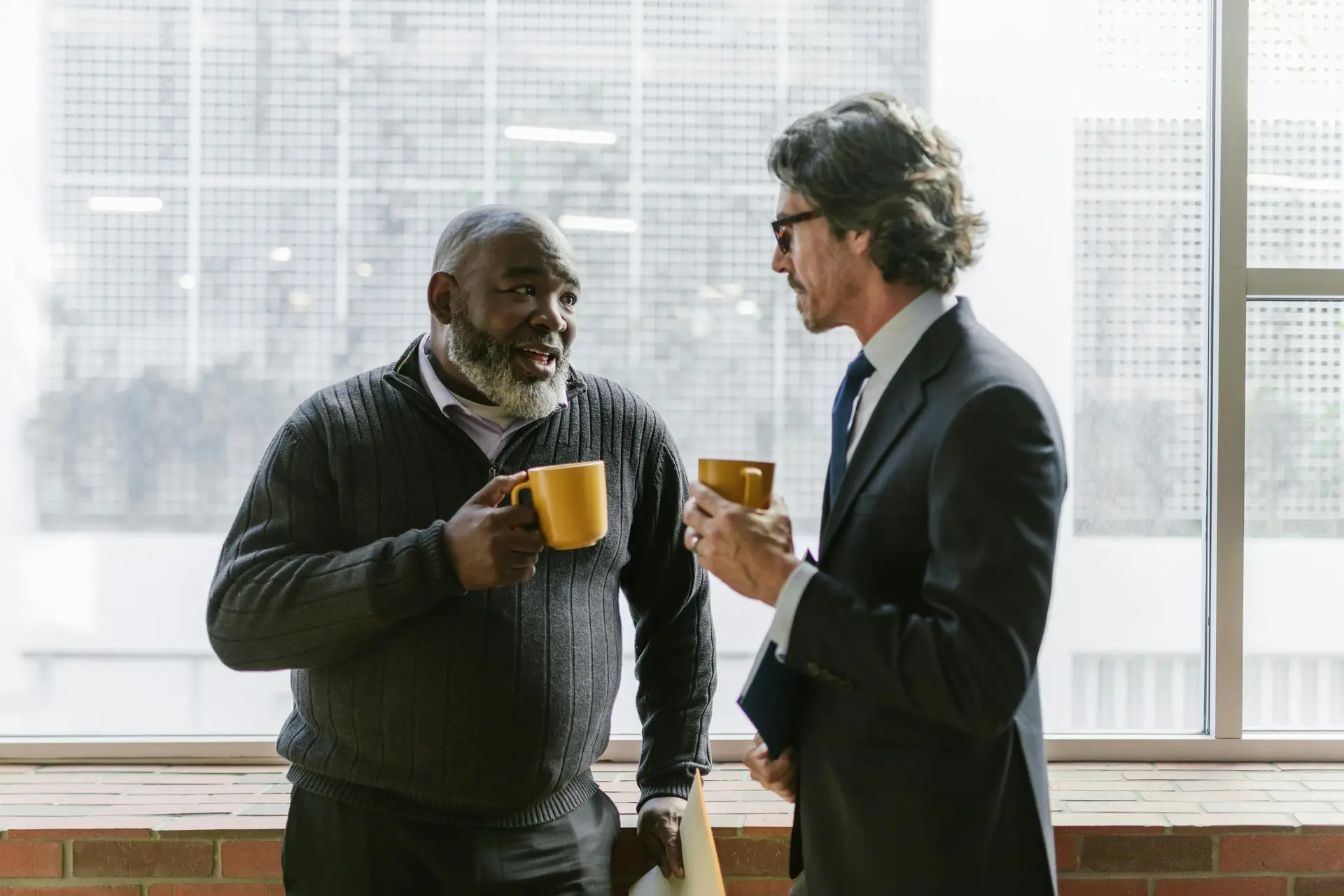 2 Men at a London Cybersecurity Consulting Firm Enjoying a Coffee Together
